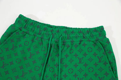 Green all-over logo shorts